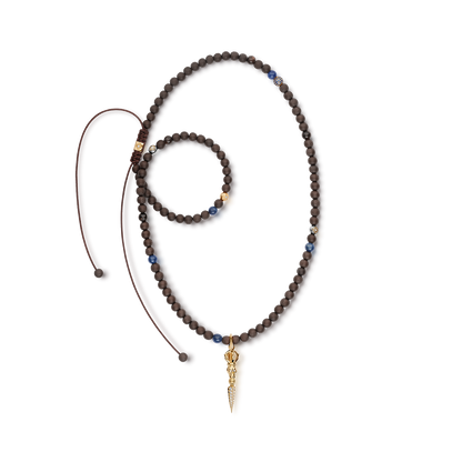 SHAMBALLA Necklace with Skull Phurpa Pendant in 18K yellow gold with white diamonds, blue sapphires, and brown sapphires, by Shamballa Jewels
