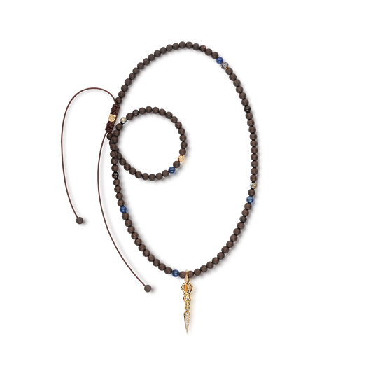 SHAMBALLA Necklace with Skull Phurpa Pendant in 18K yellow gold with white diamonds, blue sapphires, and brown sapphires, by Shamballa Jewels
