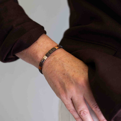 6mm SHAMBALLA Lock Bracelet in 18K yellow gold with brown diamonds, blue sapphires, and orange carnelian, by Shamballa Jewels
