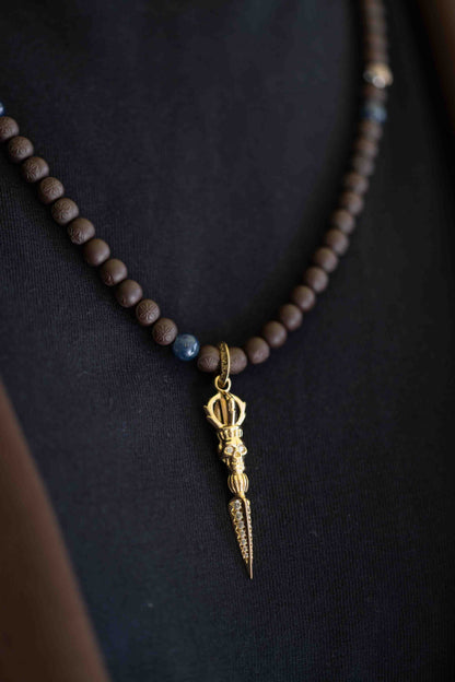 SHAMBALLA Necklace with Skull Phurpa Pendant in 18K yellow gold with white diamonds, blue sapphires, and brown sapphires, by Shamballa Jewels