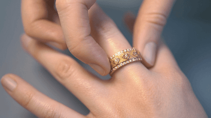 Animation of the SOS Spin Ring's center spinning, 18K white gold with diamonds